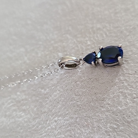 STERLING SILVER CREATED BLUE SAPPHIRE WITH DIAMOND ACCENT PENDANT APPROX 18" - Picture 2 of 15